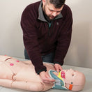 Switch Student applying neck brace to closed fracture trauma model 3 image