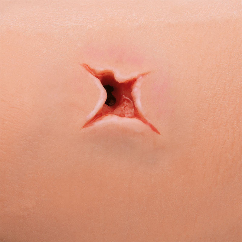 Bleeding control arm simulator with through and through gunshot wound